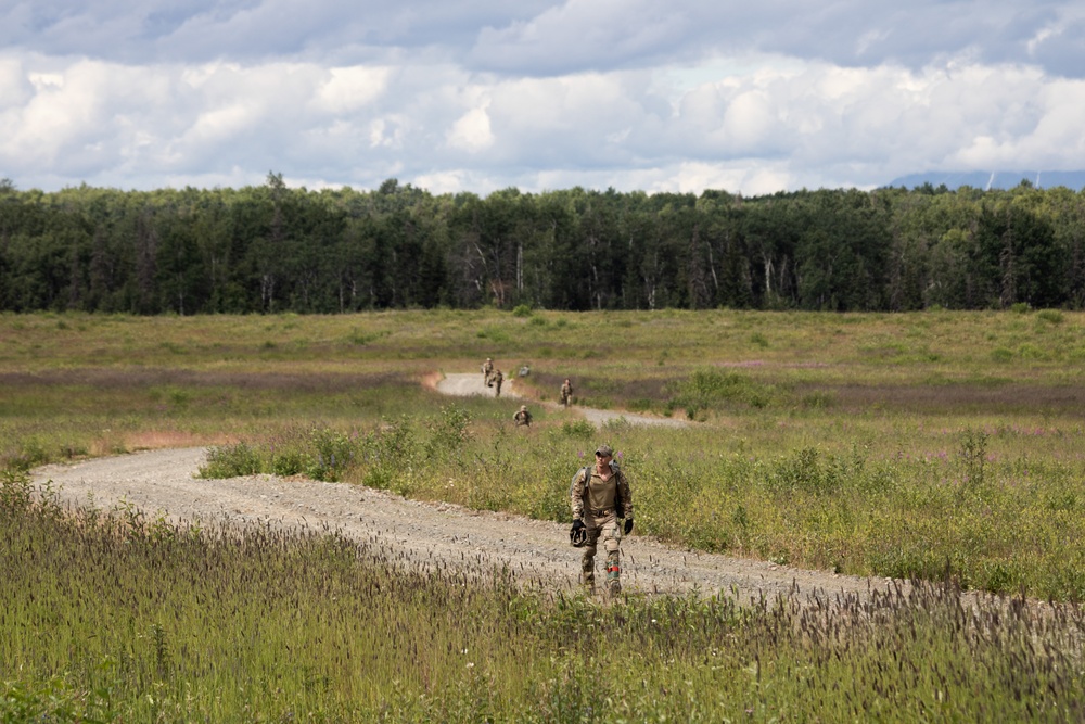 Alaska Air National Guard aviators and Air Force Special Warfare Airmen conduct airborne training