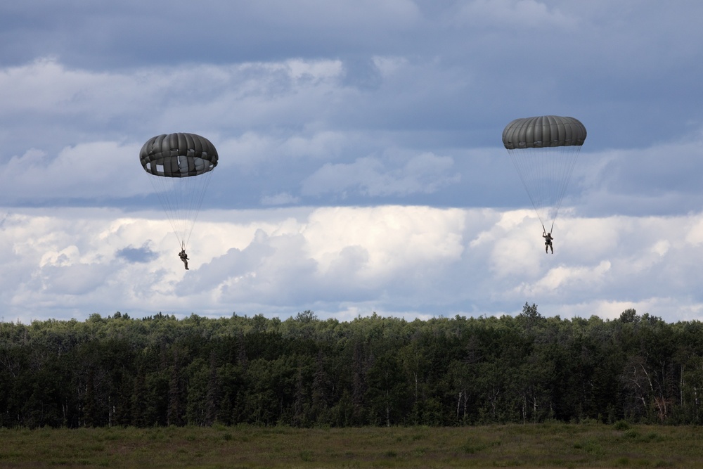 Alaska Air National Guard aviators and Air Force Special Warfare Airmen conduct airborne training