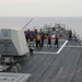 Sailors aboard the USS Howard conduct a replenishment-at-sea with the USNS Big Horn in the South China Sea