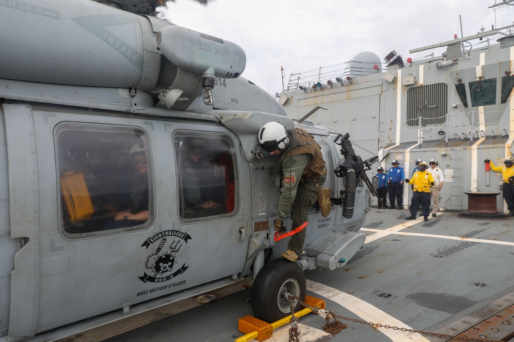 Sailors aboard the USS Howard conduct flight quarters in the South China Sea
