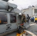 Sailors aboard the USS Howard conduct flight quarters in the South China Sea