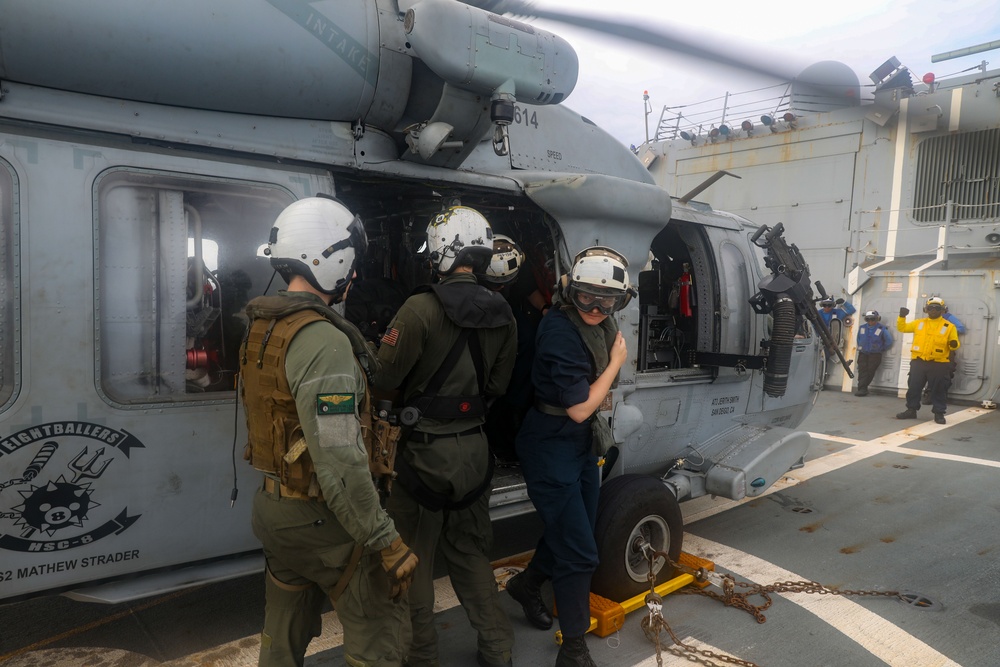 Sailors aboard the USS Howard conduct flight quarters in the South China Sea