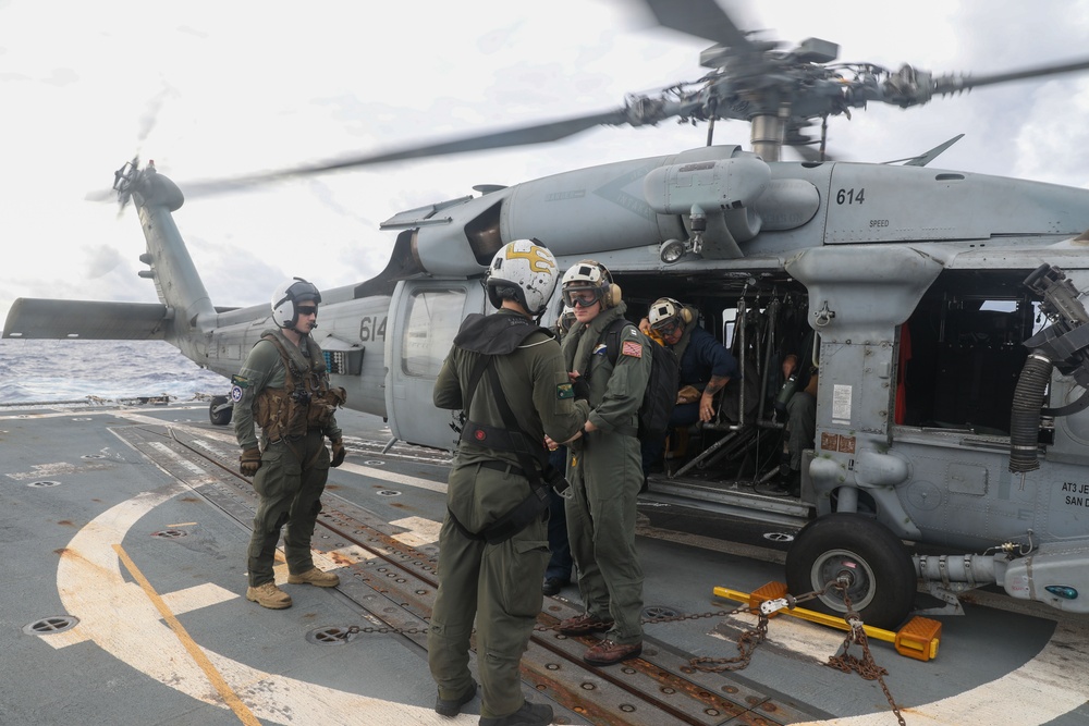 Sailors aboard the USS Howard conduct flight quarters in the South China Sea