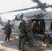 Sailors aboard the USS Howard conduct flight quarters in the South China Sea