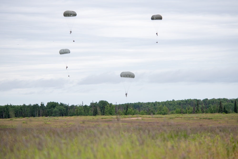 Pararescuemen, paratroopers, tactical air controllers conduct joint airborne operations