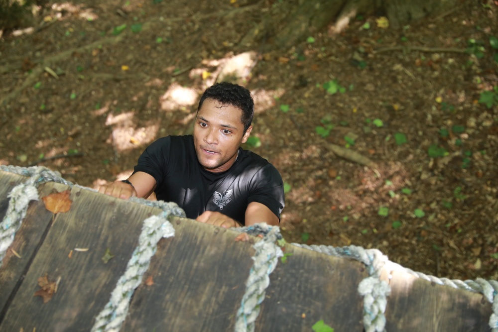 Soldier Climbs an Obstacle