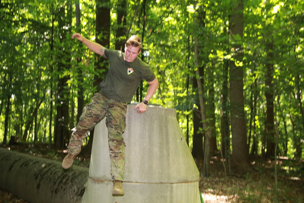 Soldier Leaps From an Obstacle