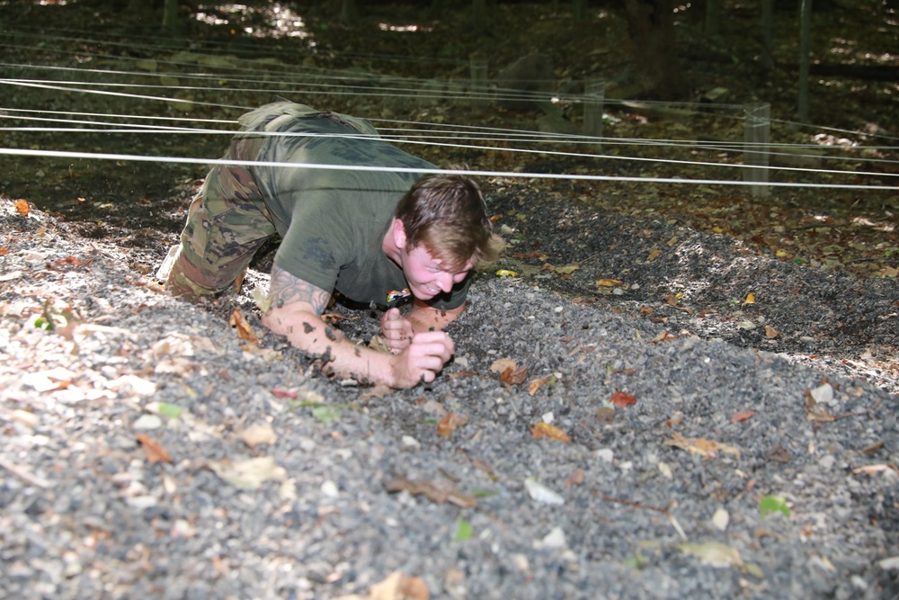 Soldier Crawls Through an Obstacle