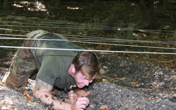 Soldier Crawls Through an Obstacle