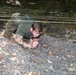 Soldier Crawls Through an Obstacle