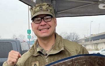 Soldier Holds a Baltimore Ravens Shield