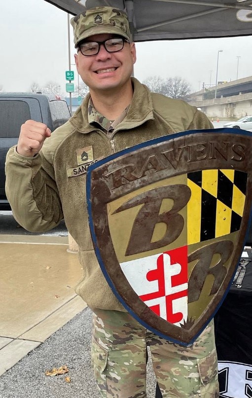 Soldier Holds a Baltimore Ravens Shield