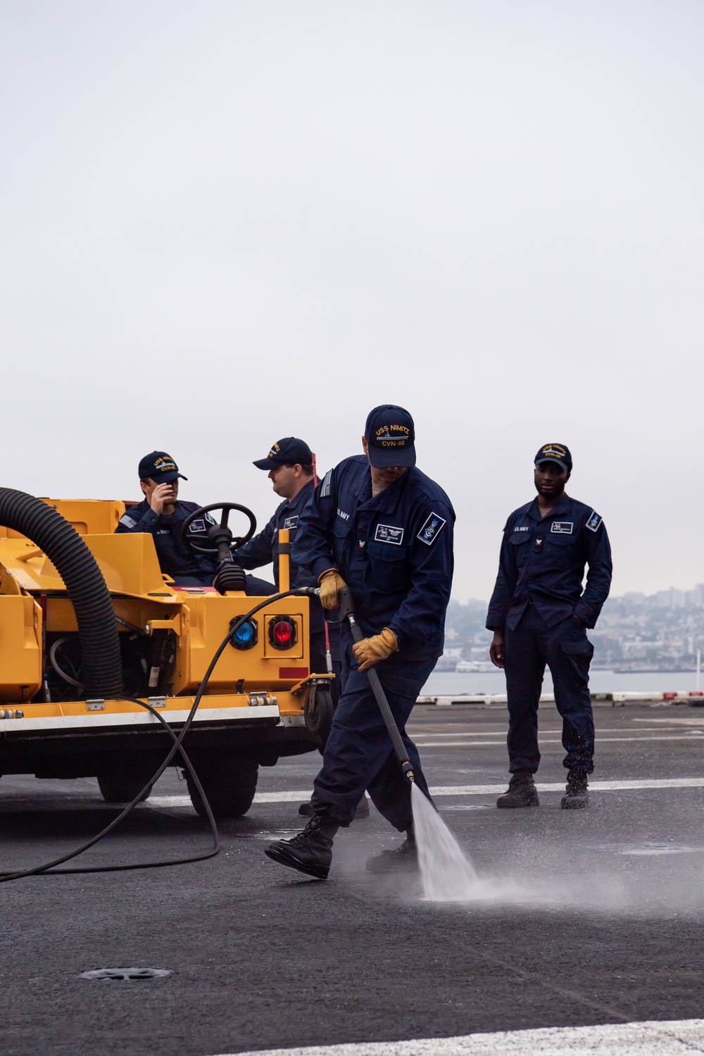 Sailors Clean Flight Deck