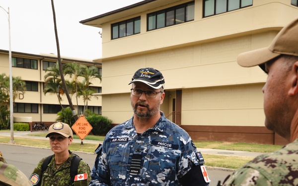 Royal Australian Air Force Group Captain Glenn Pascoe works alongside medical personnel during RIMPAC 2024.jpg