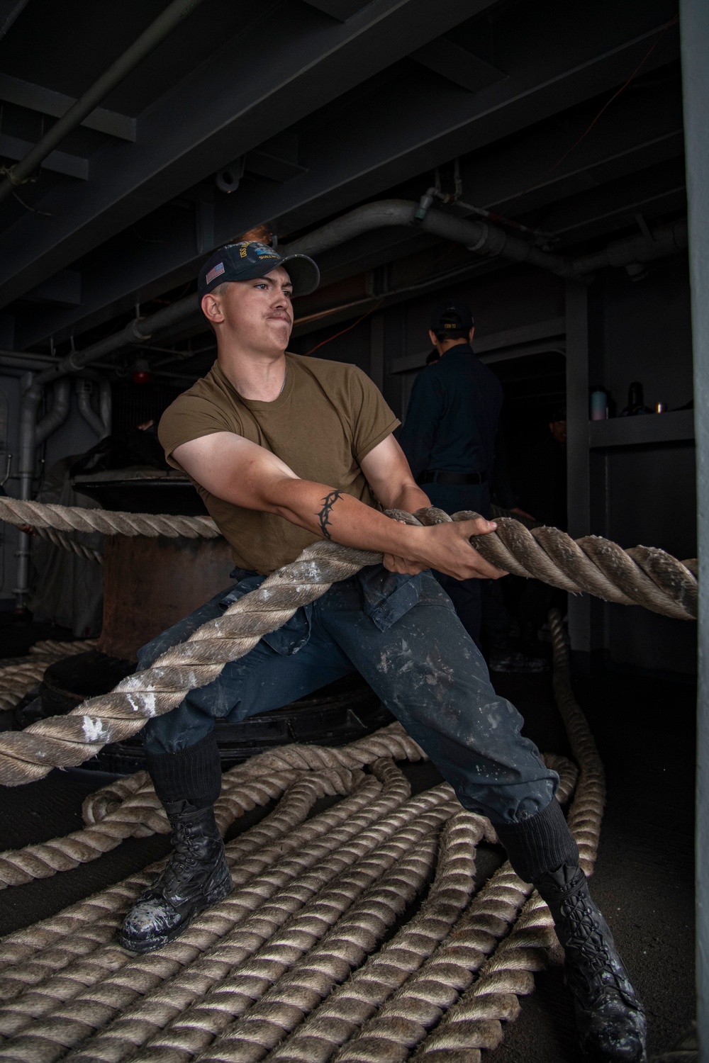 Abraham Lincoln Sailor heaves in line