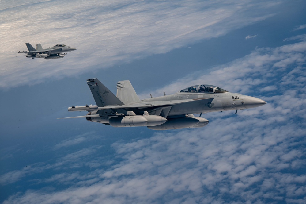 63rd Air Refueling Squadron refuels Navy F-18