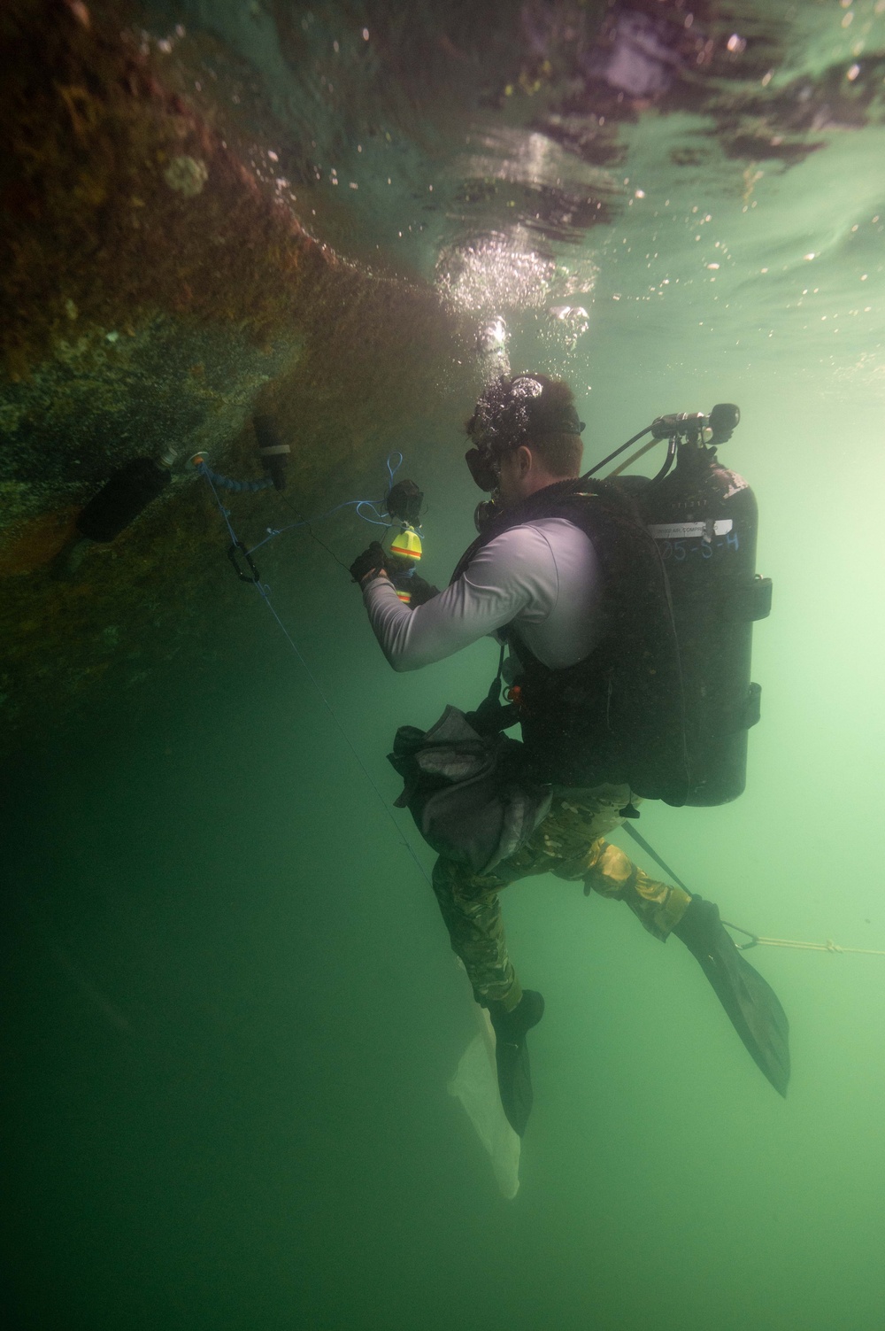 Navy EOD Technicians participate in hull clearance training during RIMPAC 2024