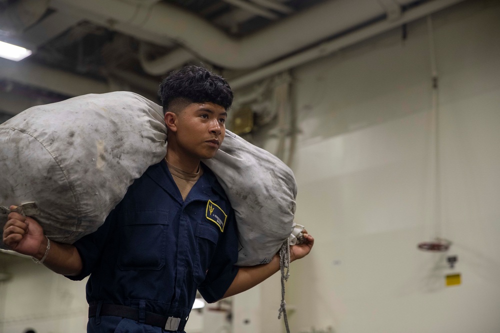 Tripoli Sailor Moves Bags of Life Preservers