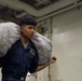 Tripoli Sailor Moves Bags of Life Preservers