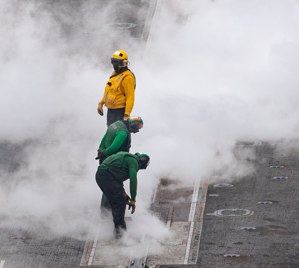 Nimitz Sailors Check A Catapult Launcher