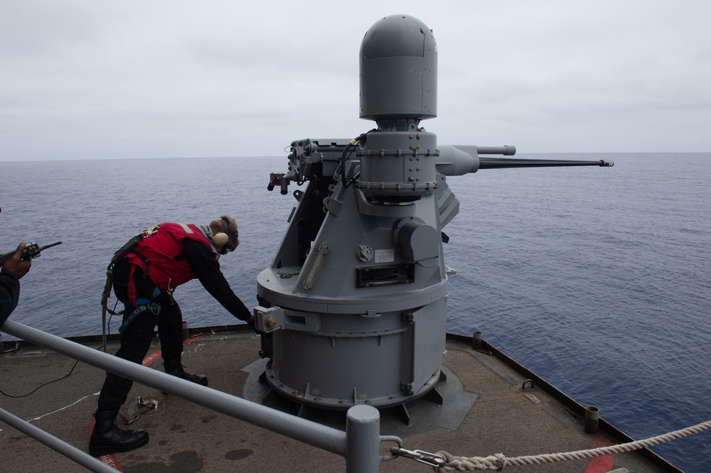 USS Ronald Reagan (CVN 76) Sailors fire an MK-38 machine gun