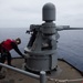 USS Ronald Reagan (CVN 76) Sailors fire an MK-38 machine gun