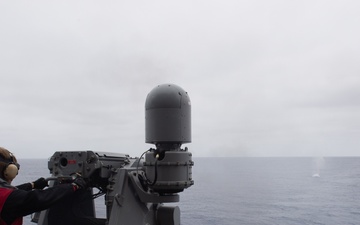 USS Ronald Reagan (CVN 76) Sailors fire a MK-38 machine gun