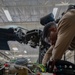 Maintainers change engine on HH-60W Jolly Green II helicopter