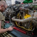 Maintainers change engine on HH-60W Jolly Green II helicopter