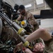 Maintainers change engine on HH-60W Jolly Green II helicopter