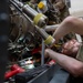 Maintainers change engine on HH-60W Jolly Green II helicopter