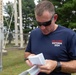 Capt. Zachary Grimes checks his map