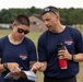 Maj. Sterling Broadhead helps 1st Lt. Susan Janfrancisco,