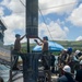 USS Frank Cable conducts an expeditionary reload of TLAMs with USS Florida