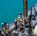 USS Frank Cable conducts an expeditionary reload of TLAMs with USS Florida