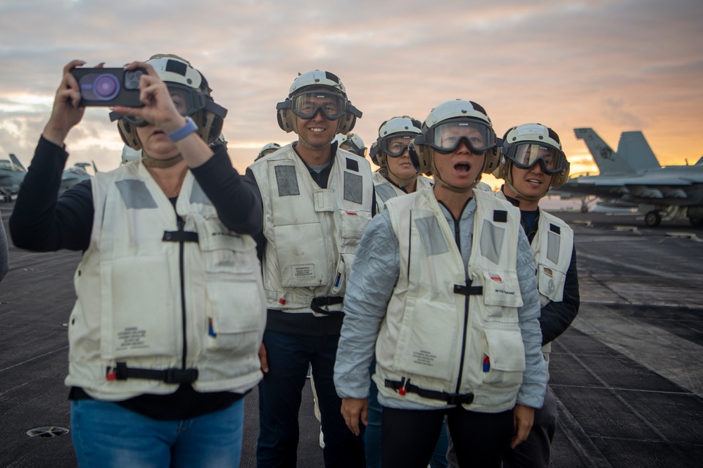 Distinguished visitors view flight operations aboard USS Carl Vinson during RIMPAC 2024