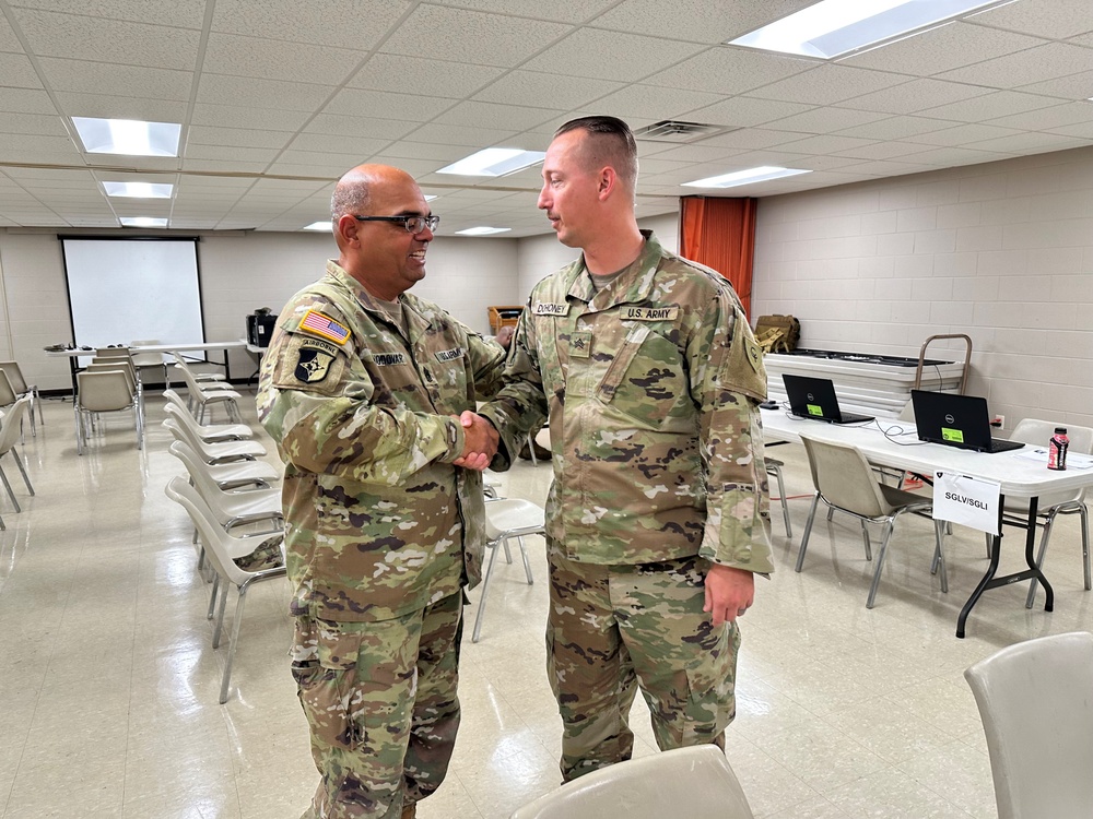 38th ID human resource sergeant receives challenge coin from leadership