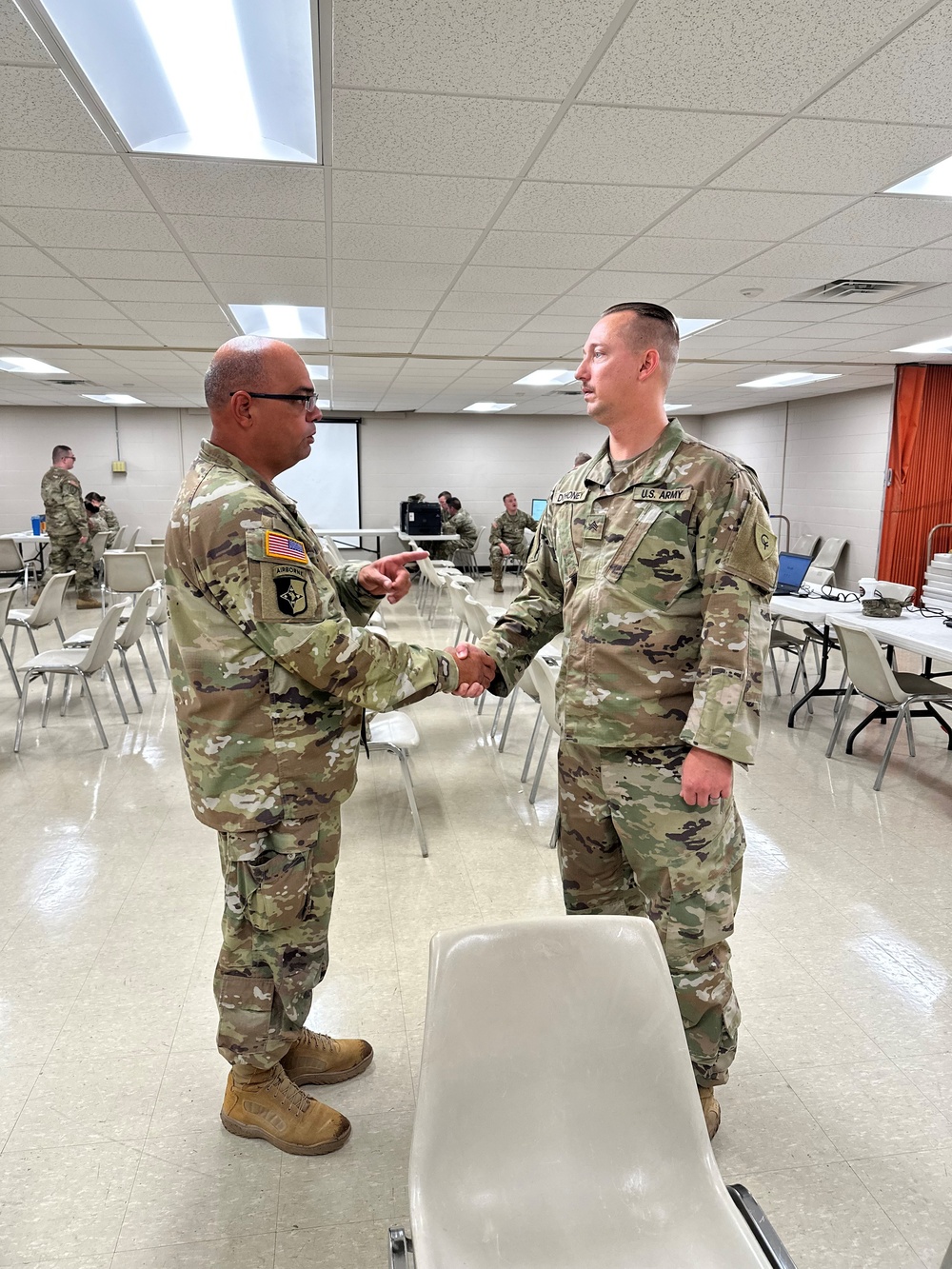 38th ID human resource sergeant receives challenge coin from leadership