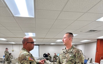 38th ID human resource sergeant receives challenge coin from leadership