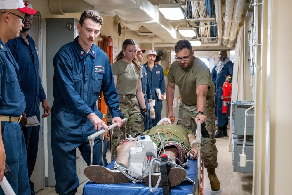 Patient transport during medical training aboard USS Somerset