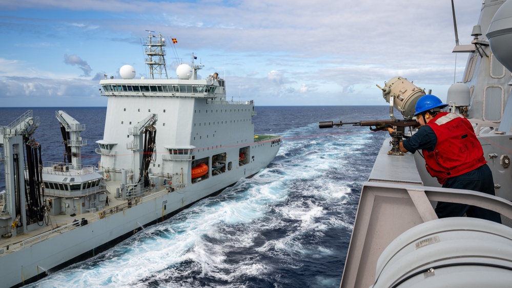 USS Somerset Sailor fires shot line to Royal Canadian Navy MV Asterix