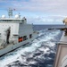 USS Somerset Sailor fires shot line to Royal Canadian Navy MV Asterix