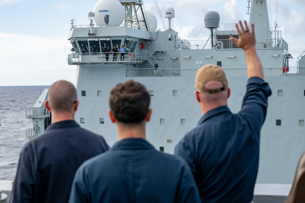 USS Somerset waves to Royal Canadian Navy MV Asterix