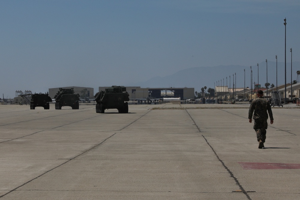 1st LAR Marines load aircraft in preparation for REDEX