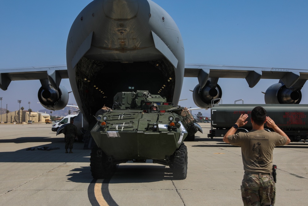 1st LAR Marines load aircraft in preparation for REDEX