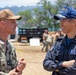 Rear Adm. Kazushi Yokota speaks with U.S. Navy Capt. Doug Whimpey following ENDEX of HADR