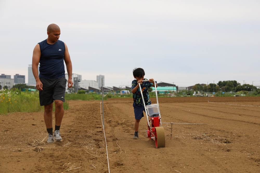 Camp Zama volunteers plant (sunflower) seeds of friendship with neighboring Zama City