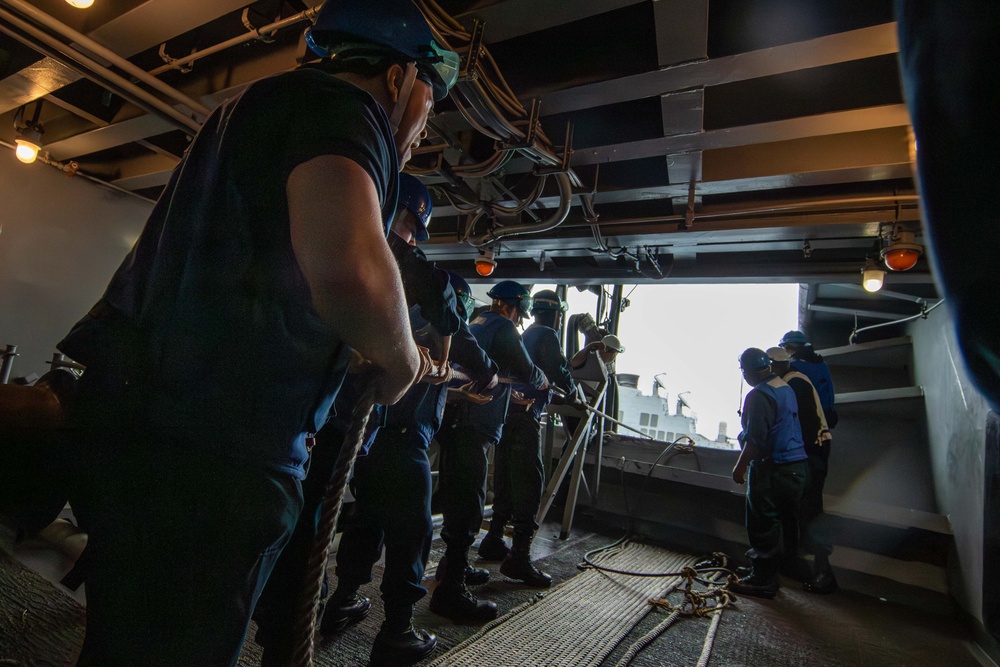 Abraham Lincoln conducts a fueling-at-sea with USS O'Kane
