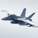 FA-18F Super Hornet flies over HMCS Vancouver