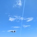 FA-18F Super Hornet flies over HMCS Vancouver